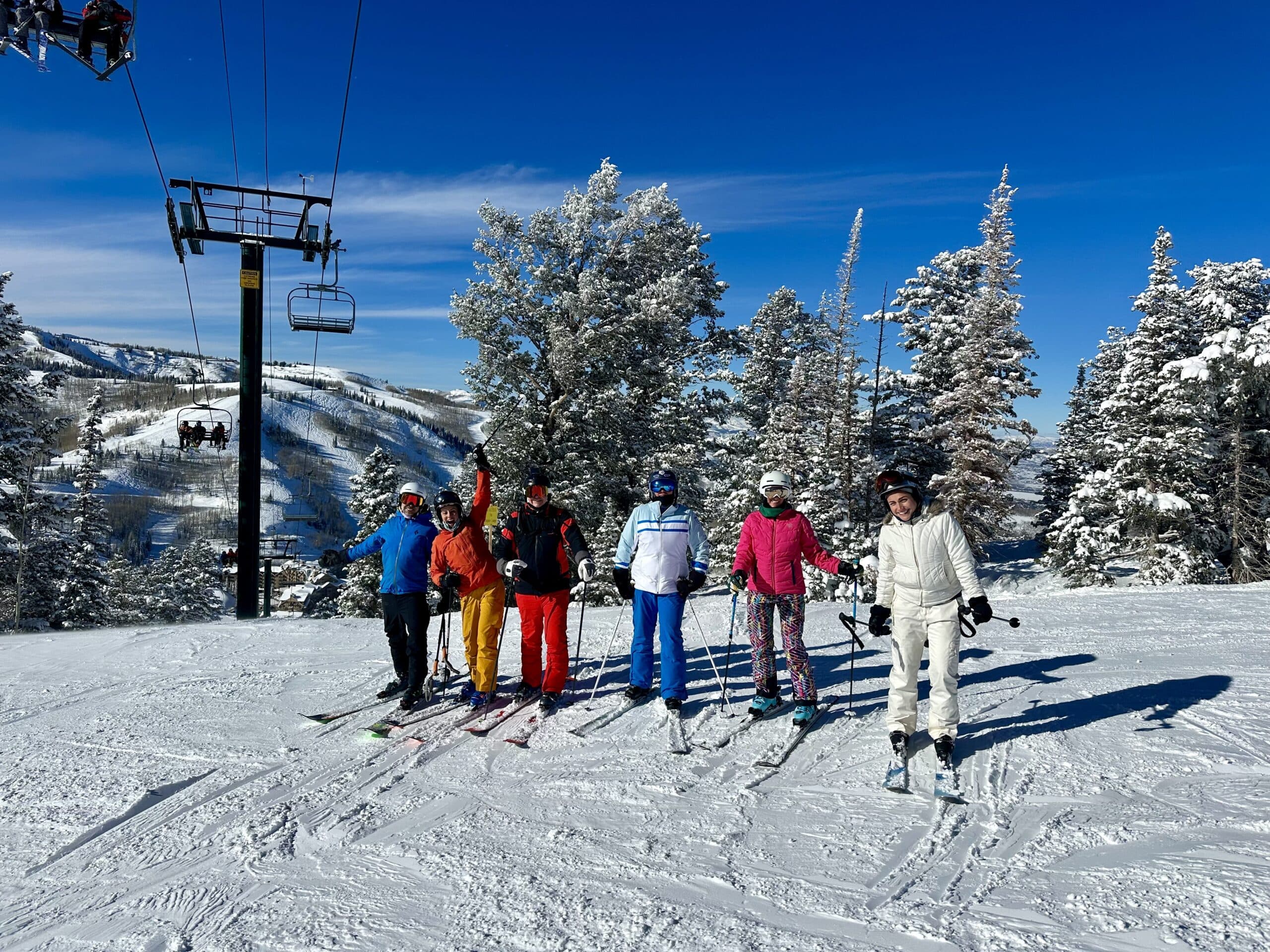 6 skiers ready to start down the slope