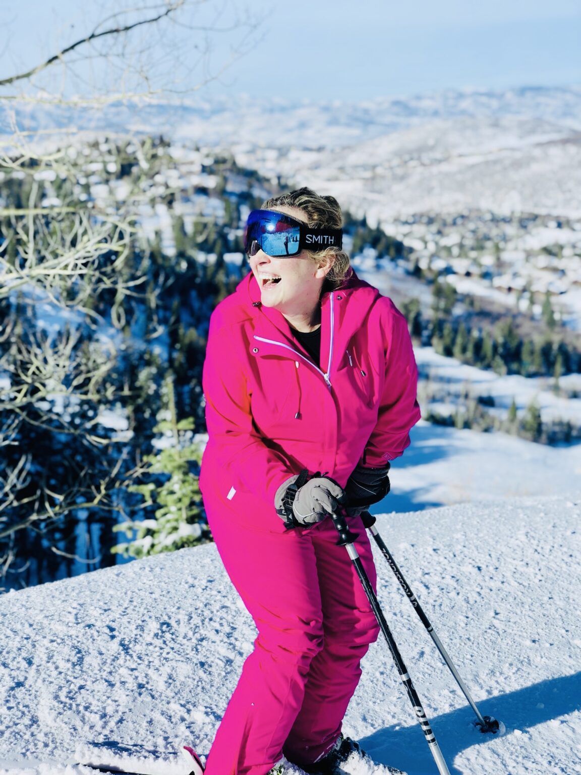 skier dressed in pink with goggles